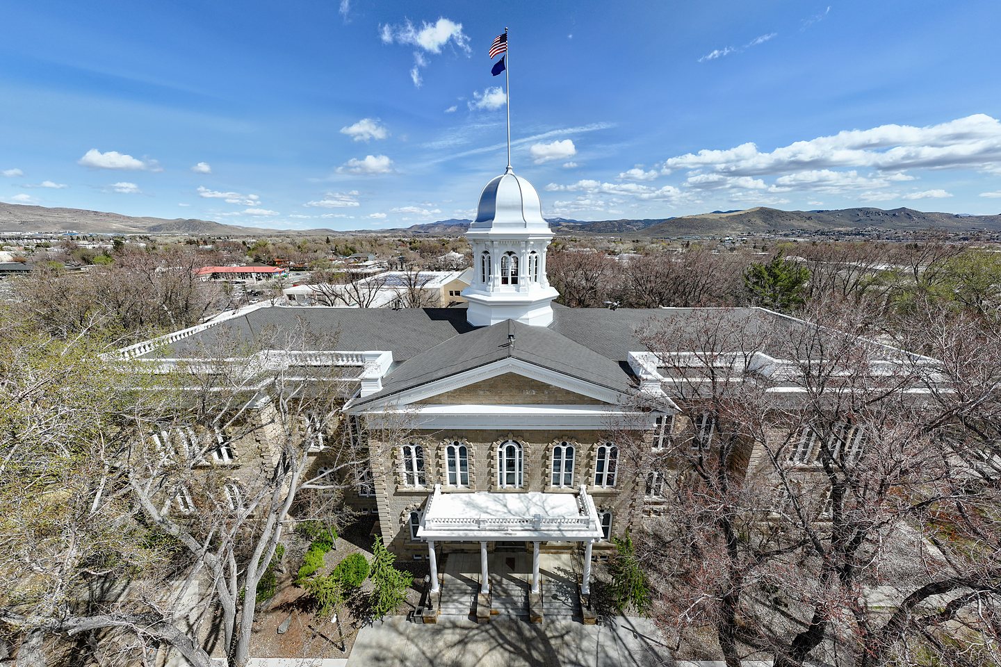 Nevada State Capitol building with silver dome in Carson City, Nevada, daytime aerial view. Carson City home loans and mortgage pre-approval with Art Loera, PRMG.